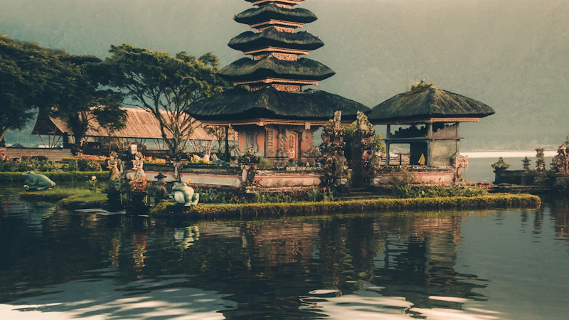 Bali temple with lush green terraces and tropical landscape.